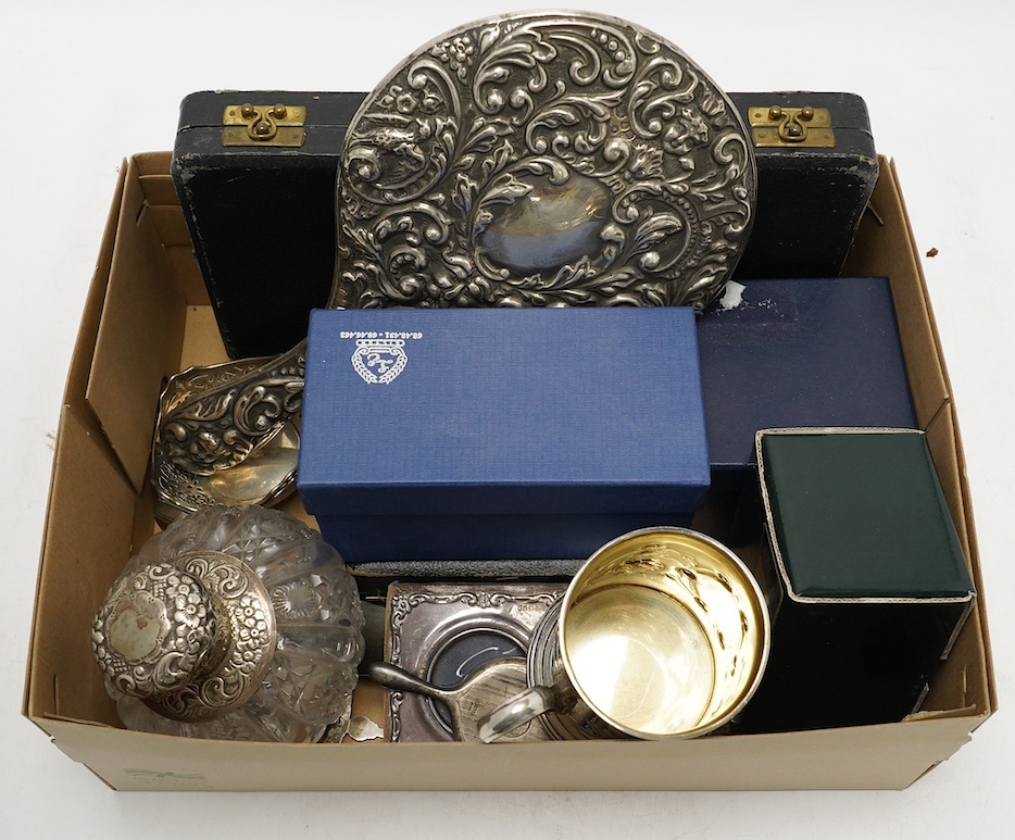 Sundry small silver and 800 standard items, including a hand mirror, mounted glass scent bottle, dwarf candlestick, small photograph frame, pair of bonbon dishes, cased glass butter dishes with silver butter knives, etc.